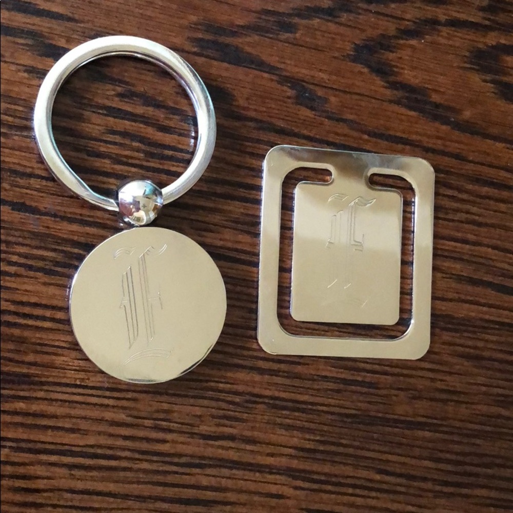 Silver plated key ring and bookmark. Engraved “E”